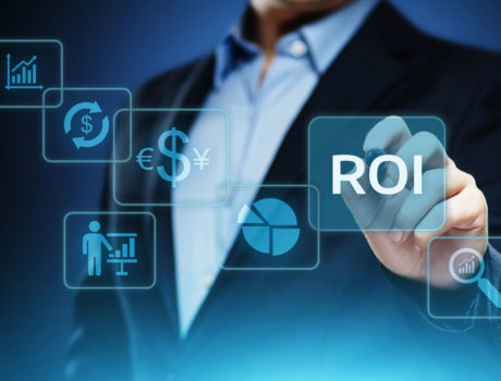 business man highlighting ROI icon with other icons showing in blue glass COMMAND Service Systems